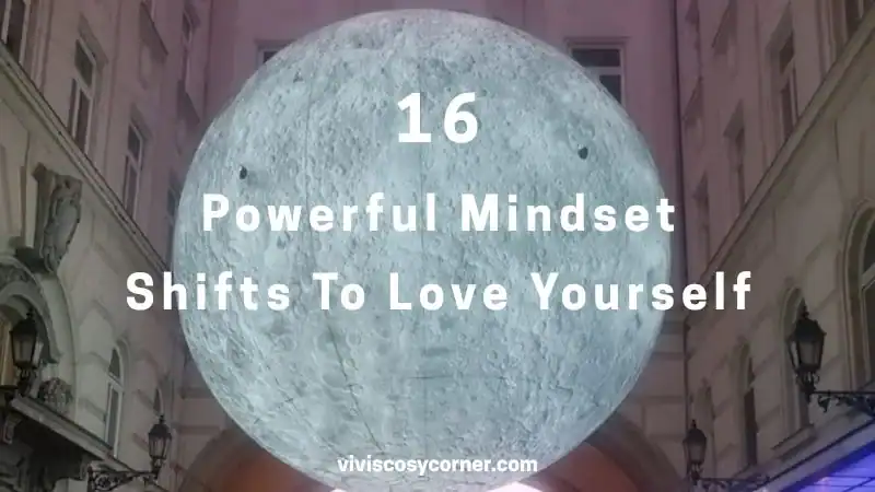 Promotional graphic with a large pale moon and the title: '16 Powerful Mindset Shifts To Love Yourself' overlaid, set against a city street background.