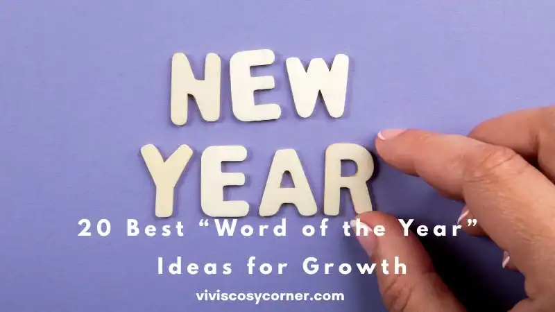 Hand places white wooden letters spelling NEW YEAR on a purple background.