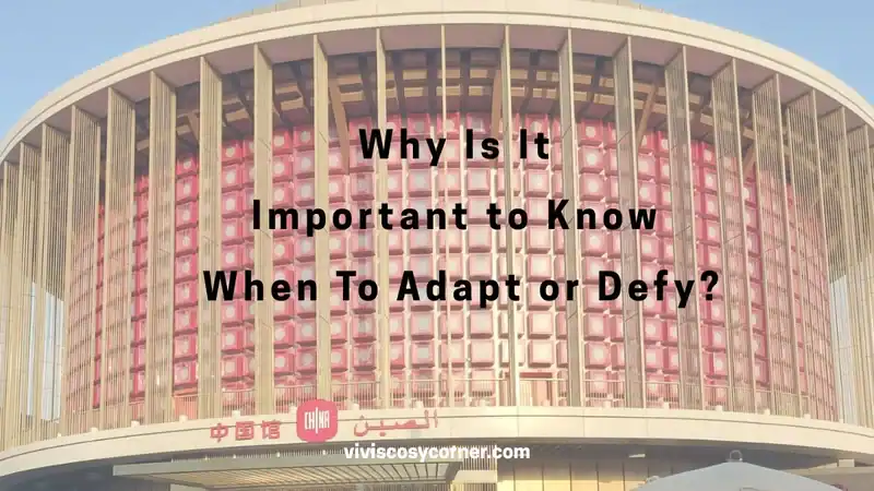 Cover image showing a curved building with pink panels and bold text: 'Why Is It Important to Know When To Adapt or Defy?' with a site credit at the bottom (viviscosycorner.com).